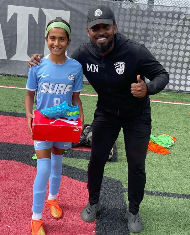 Coach Mohamed Noor with student